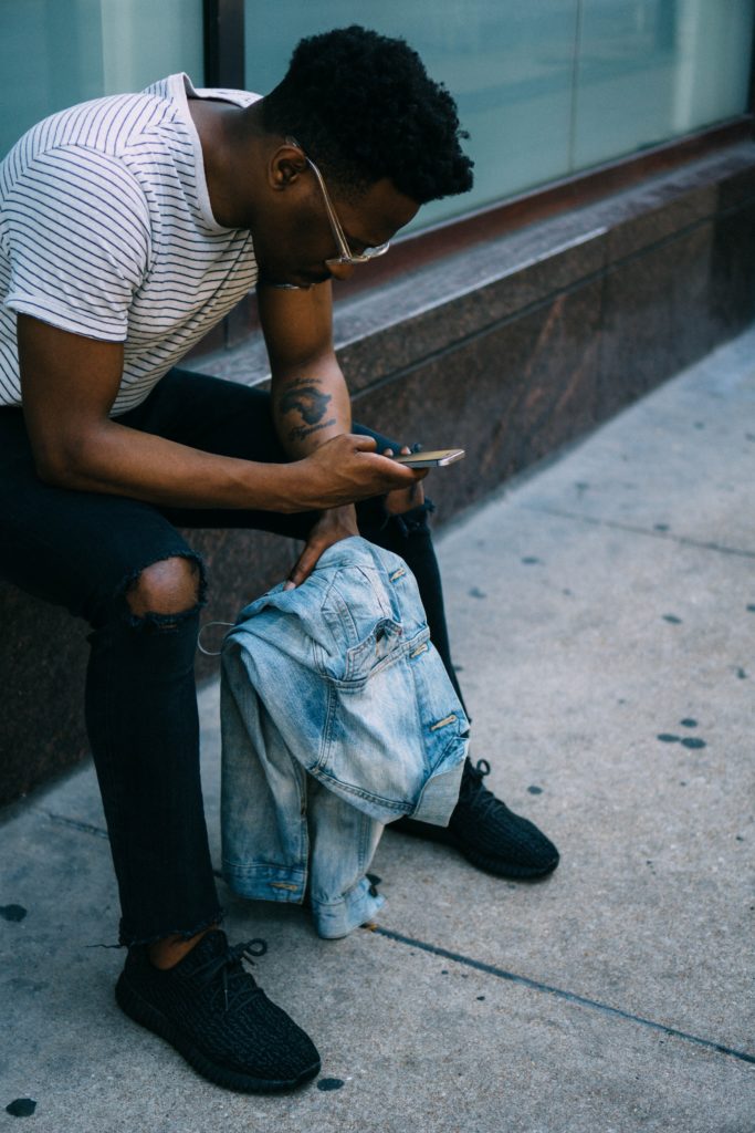 African man with smartphone